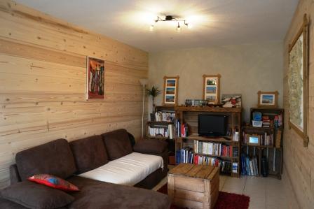 Pose de lambris en épicéa chablis et d'un enduit décoratif